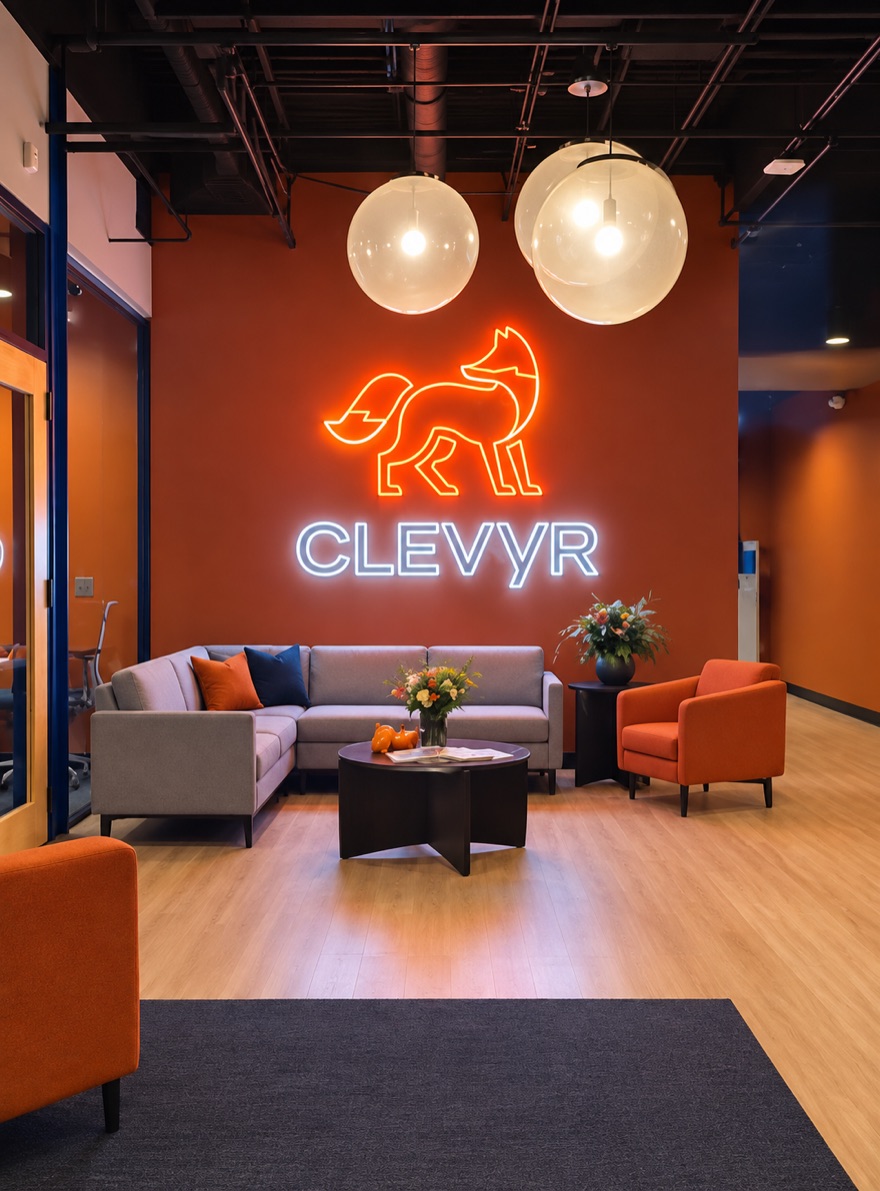The Clevyr office lobby, with the neon fox sign lit above the seating area