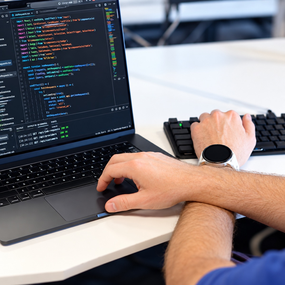 A Clevyr developer at work on a laptop